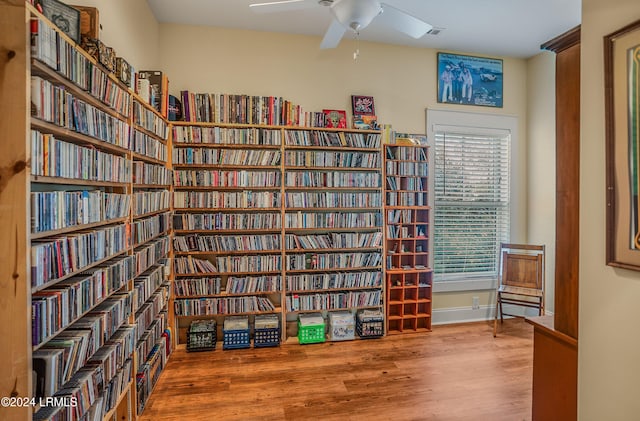 interior space with wood-type flooring and ceiling fan