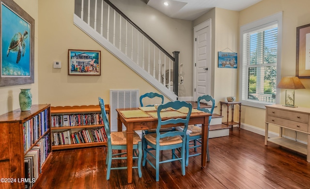 dining space featuring dark hardwood / wood-style floors