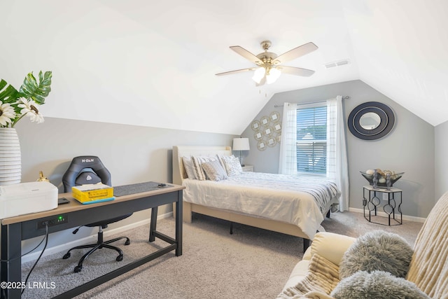 carpeted bedroom with ceiling fan and vaulted ceiling