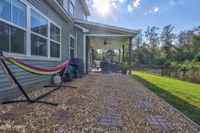 view of yard featuring ceiling fan and a patio area