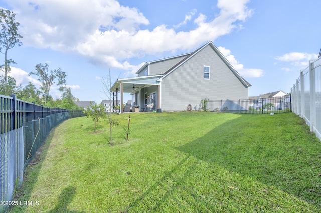 rear view of property featuring a yard