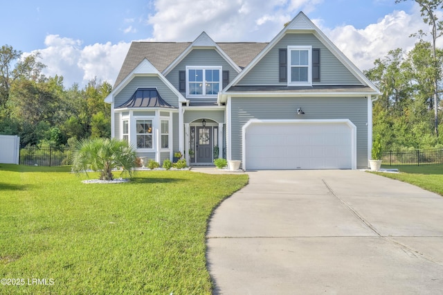 view of front of home with a garage and a front yard