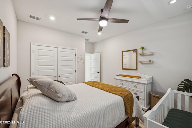 bedroom with ceiling fan and a closet