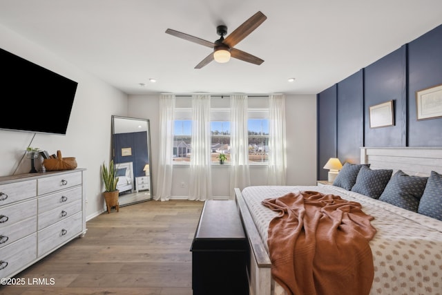 bedroom featuring ceiling fan and light hardwood / wood-style floors