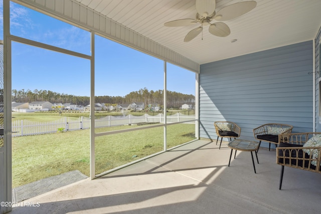 sunroom featuring plenty of natural light and ceiling fan