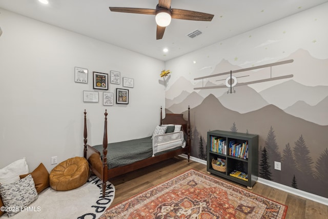 bedroom featuring hardwood / wood-style flooring and ceiling fan