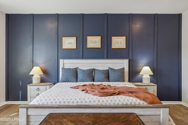 bedroom with hardwood / wood-style floors