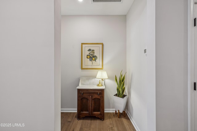 corridor featuring light hardwood / wood-style floors