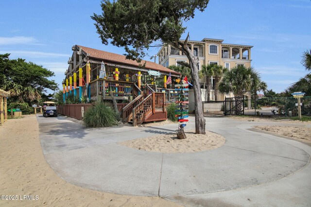 663 William Hilton Pkwy Unit 3404, Hilton Head Island, SC 29928 - view of home's community featuring curved driveway, fence, and stairway