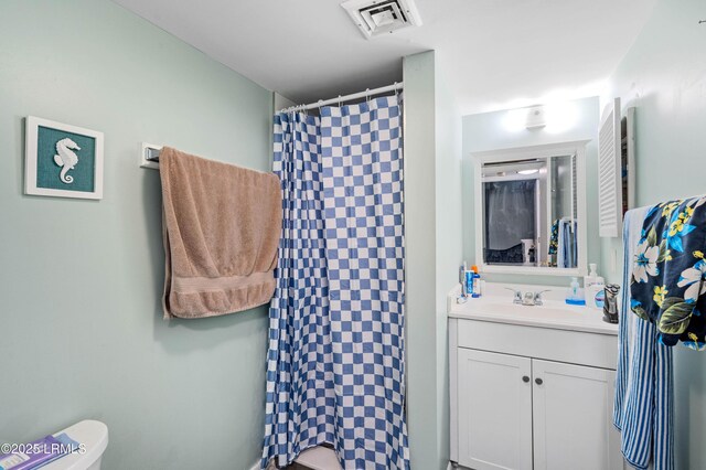 663 William Hilton Pkwy Unit 3404, Hilton Head Island, SC 29928 - full bathroom with vanity, toilet, and a shower with shower curtain