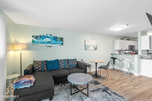 663 William Hilton Pkwy Unit 3404, Hilton Head Island, SC 29928 - living area with light wood-style floors and baseboards