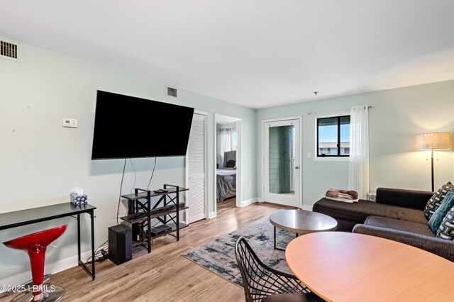 663 William Hilton Pkwy Unit 3404, Hilton Head Island, SC 29928 - living area with light wood-style flooring and baseboards