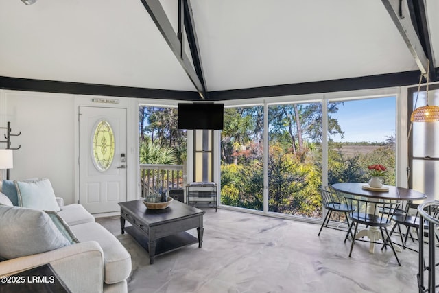 sunroom with lofted ceiling with beams