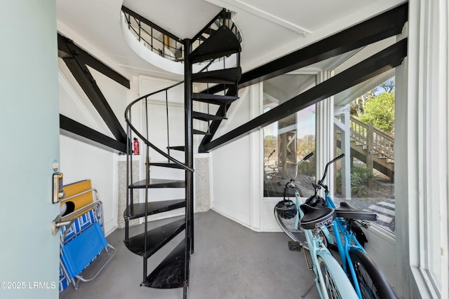 stairs featuring concrete floors