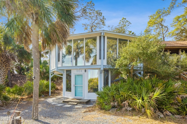 view of front of property with a sunroom