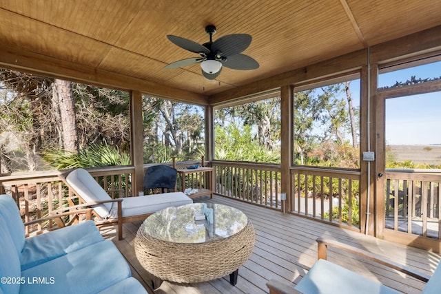 sunroom / solarium with wooden ceiling and ceiling fan