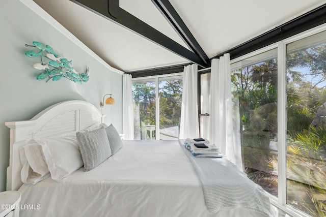 bedroom with access to exterior and vaulted ceiling with beams