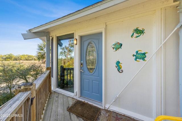 entrance to property featuring a balcony