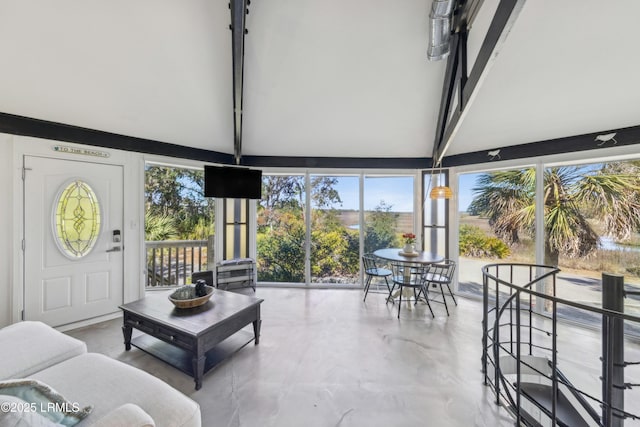 interior space with vaulted ceiling with beams