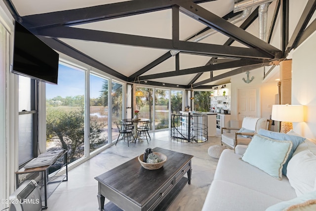 sunroom / solarium featuring lofted ceiling with beams