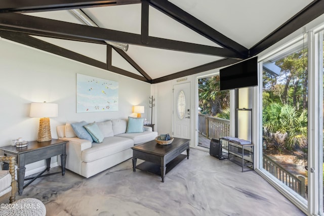 living room with lofted ceiling with beams