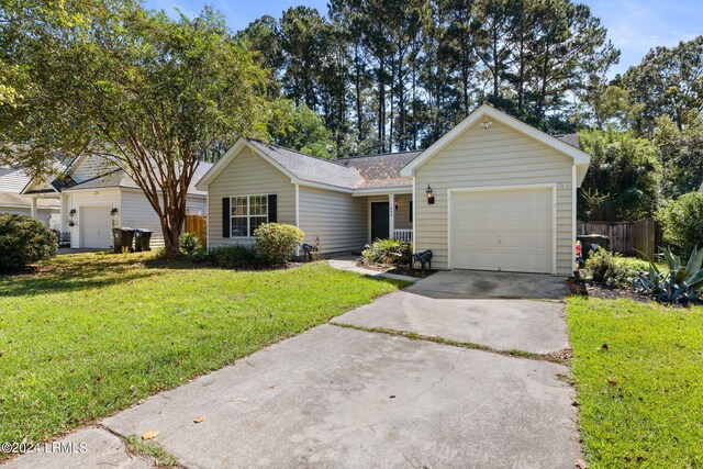 ranch-style home featuring a garage and a front yard