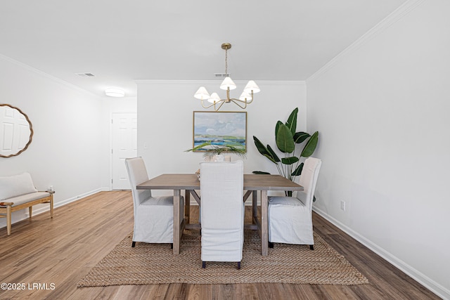 3017 Magnolia St, Beaufort, SC 29906 - dining area featuring a chandelier, wood finished floors, ornamental molding, and baseboards