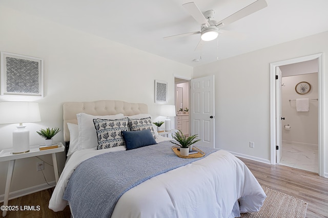 3017 Magnolia St, Beaufort, SC 29906 - bedroom featuring wood finished floors, baseboards, connected bathroom, and a ceiling fan