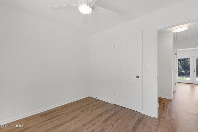 3017 Magnolia St, Beaufort, SC 29906 - unfurnished room with wood finished floors, ceiling fan, baseboards, and french doors