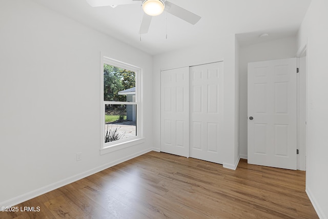 3017 Magnolia St, Beaufort, SC 29906 - unfurnished bedroom with wood finished floors, baseboards, a closet, and ceiling fan