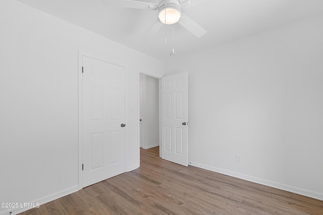3017 Magnolia St, Beaufort, SC 29906 - unfurnished bedroom featuring wood finished floors, baseboards, and a ceiling fan