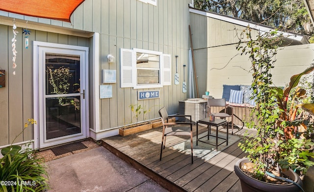 property entrance featuring a wooden deck and central AC