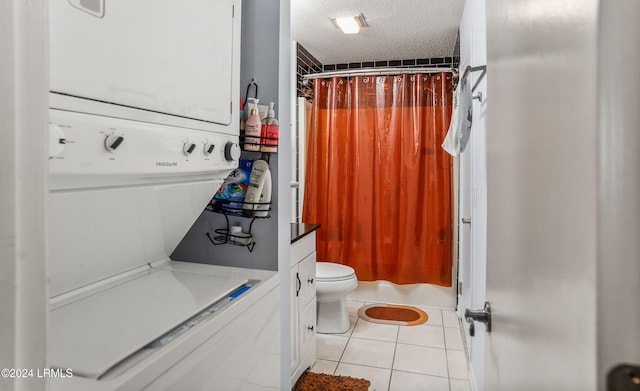 bathroom with walk in shower, stacked washer and dryer, tile patterned floors, and a textured ceiling