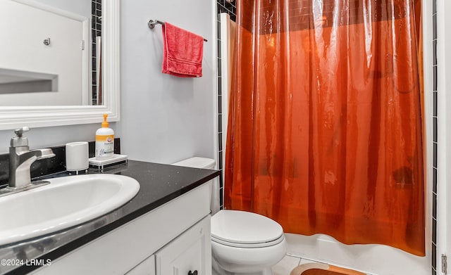 bathroom with vanity, toilet, tile patterned floors, and a shower with curtain