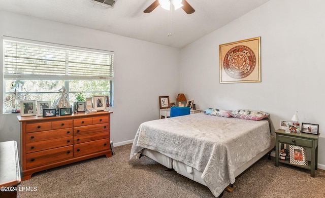 bedroom featuring lofted ceiling, ceiling fan, and carpet