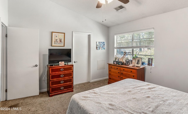 bedroom featuring ceiling fan, lofted ceiling, and carpet floors