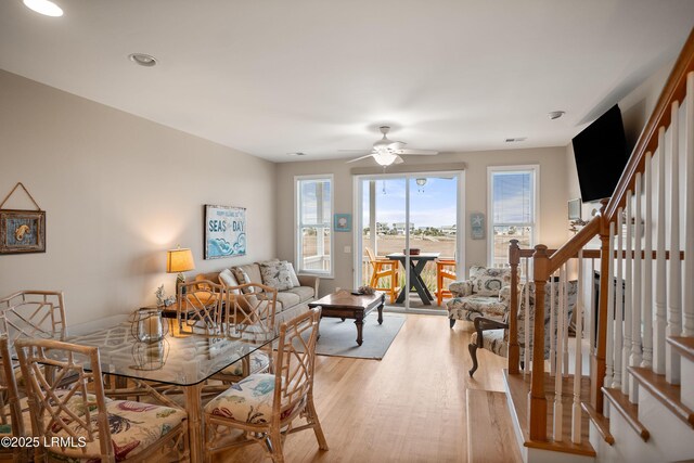 dining area with stairway, recessed lighting, a ceiling fan, and light wood-type flooring