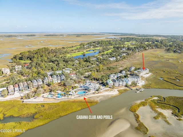 drone / aerial view featuring a residential view and a water view