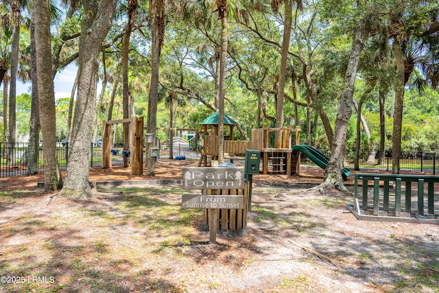 communal playground featuring fence