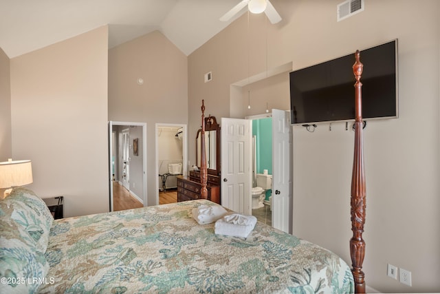 bedroom featuring ensuite bathroom, visible vents, high vaulted ceiling, and ceiling fan