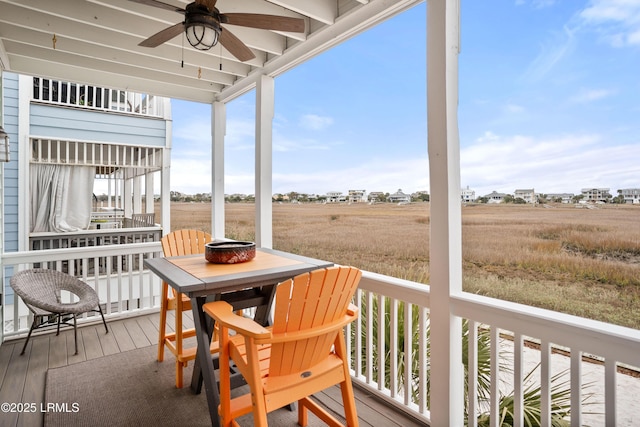 exterior space with ceiling fan and outdoor dining area