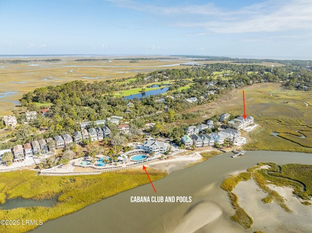 birds eye view of property featuring a water view and a residential view