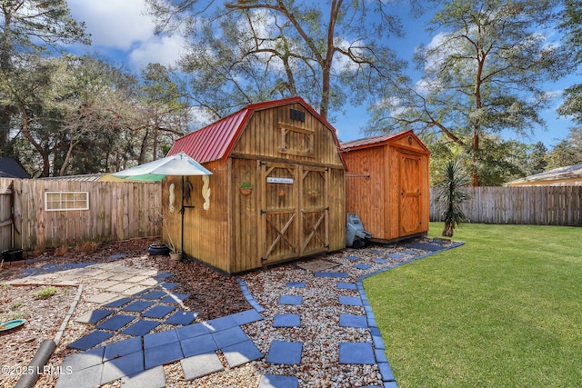 view of shed with a fenced backyard