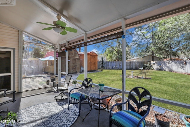 sunroom featuring vaulted ceiling and a ceiling fan