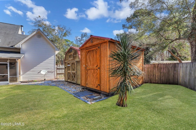 view of shed featuring a fenced backyard