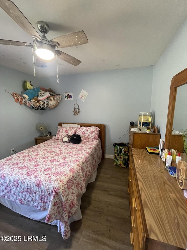 bedroom featuring dark hardwood / wood-style floors and ceiling fan