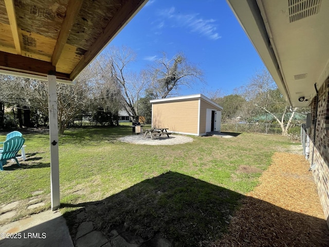 view of yard featuring central AC and an outdoor structure