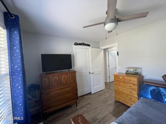 bedroom featuring ceiling fan and dark hardwood / wood-style floors