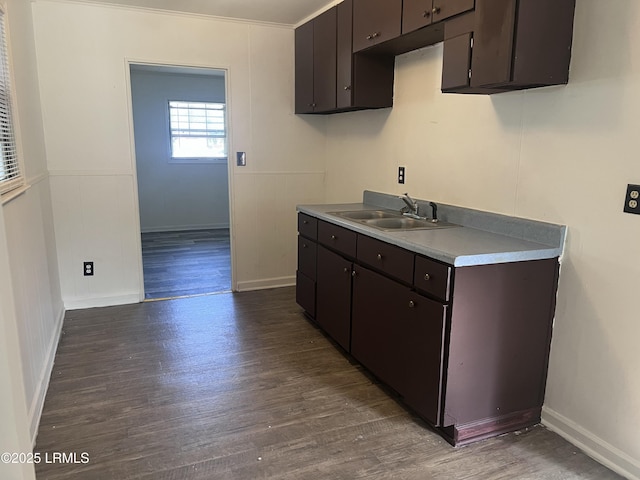 582 Parkwood Ter, Allendale, SC 29810 - kitchen with a sink, dark wood-style floors, dark brown cabinets, and baseboards