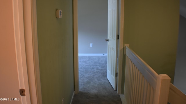 539 Candida Dr, Beaufort, SC 29906 - hallway featuring baseboards, an upstairs landing, and dark colored carpet